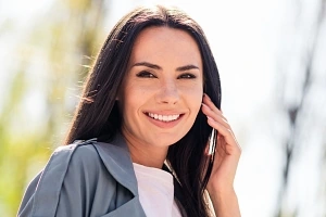 Happy woman smiling outside after Aquagold treatment